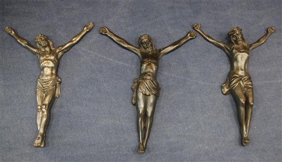 A set of three 20th century French bronze figures of Christ on the cross, H.25in.